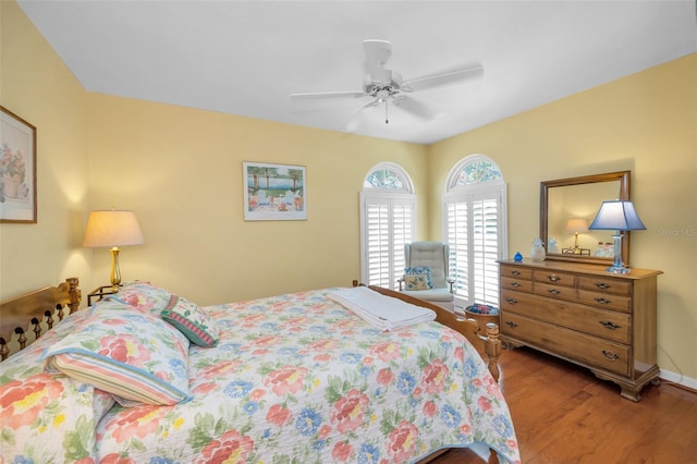 bedroom with ceiling fan and wood-type flooring