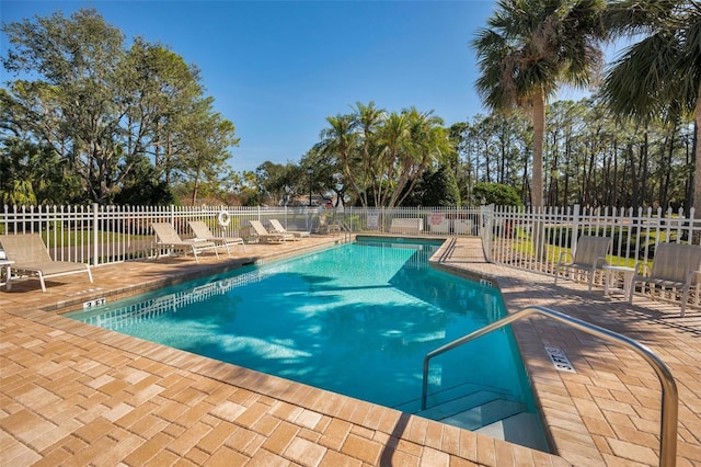 view of pool featuring a patio