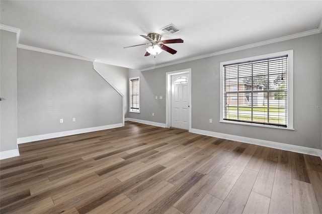 interior space featuring hardwood / wood-style flooring, ceiling fan, and crown molding