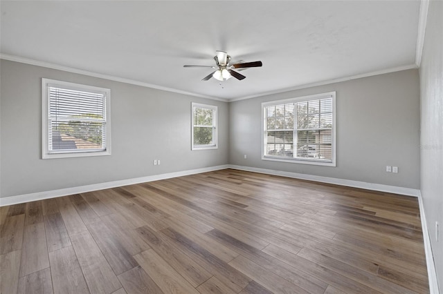 spare room with crown molding, light hardwood / wood-style flooring, and ceiling fan