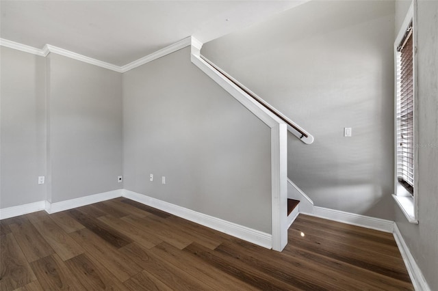 stairway featuring crown molding and wood-type flooring