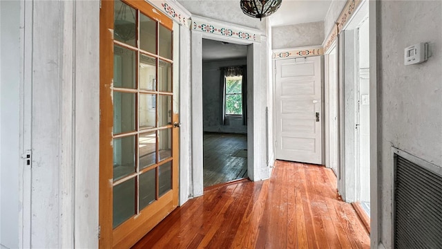 corridor featuring hardwood / wood-style flooring