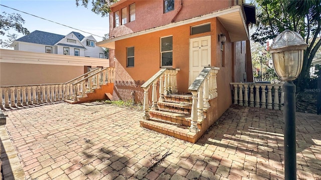 entrance to property with a patio