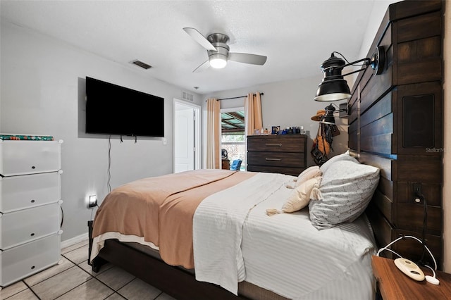 bedroom featuring light tile patterned floors and ceiling fan