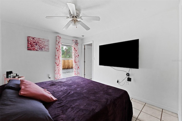 tiled bedroom featuring ceiling fan