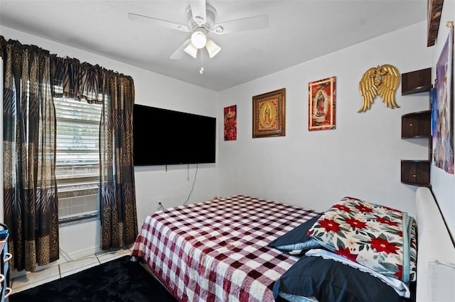 tiled bedroom with ceiling fan and cooling unit