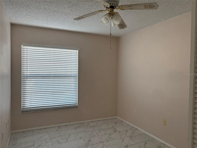 unfurnished room with a textured ceiling and ceiling fan