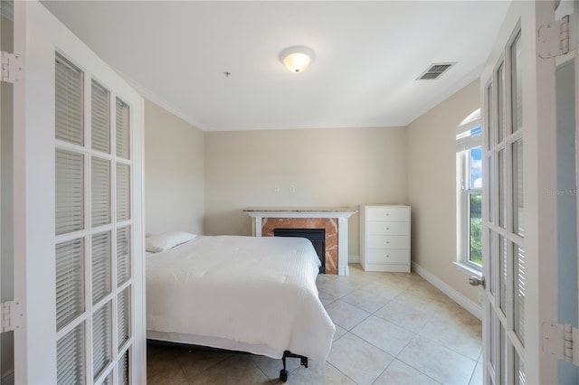 bedroom featuring light tile patterned floors