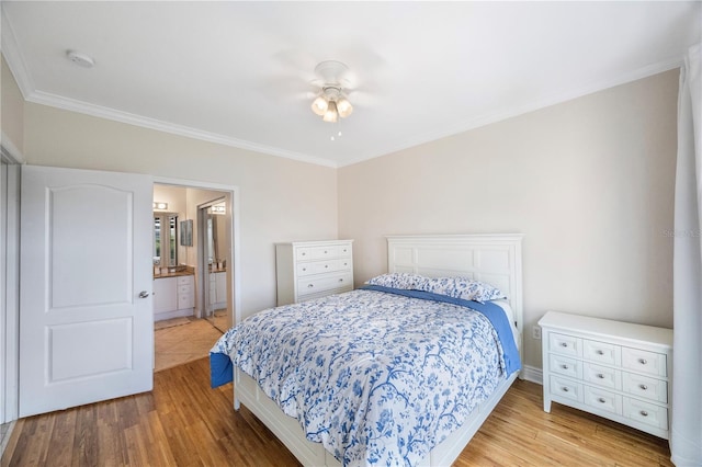 bedroom with ceiling fan, ornamental molding, light hardwood / wood-style flooring, and ensuite bath