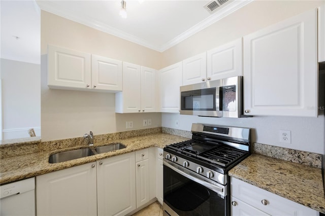 kitchen featuring light stone countertops, white cabinetry, sink, and stainless steel appliances