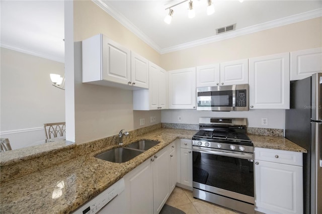 kitchen with light stone counters, white cabinetry, sink, and appliances with stainless steel finishes