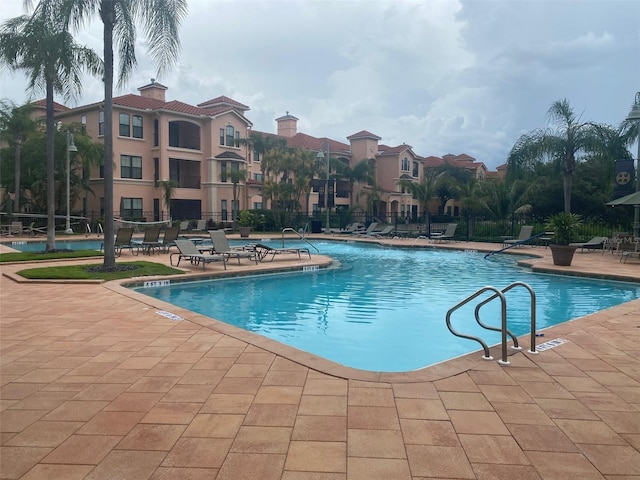 view of swimming pool with a patio