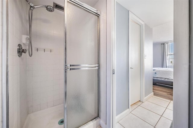 bathroom featuring tile patterned floors and walk in shower