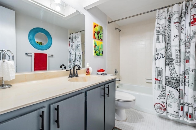 full bathroom featuring tile patterned floors, shower / bath combo with shower curtain, vanity, and toilet