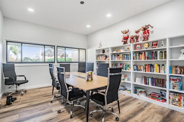 office space featuring light hardwood / wood-style floors and a healthy amount of sunlight