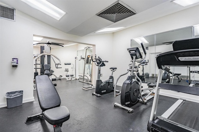 exercise room featuring lofted ceiling