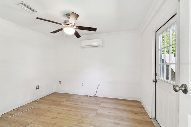 spare room featuring a wall mounted AC, ceiling fan, and crown molding