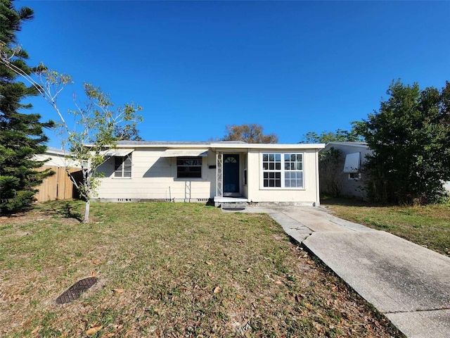 single story home featuring a front yard