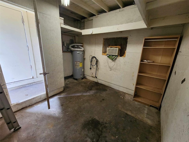 basement featuring electric water heater and a wall mounted air conditioner