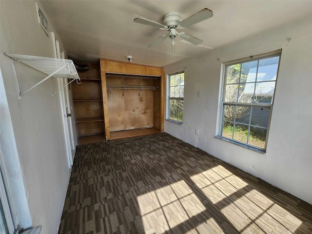 unfurnished bedroom with ceiling fan