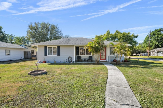 ranch-style house with a front lawn