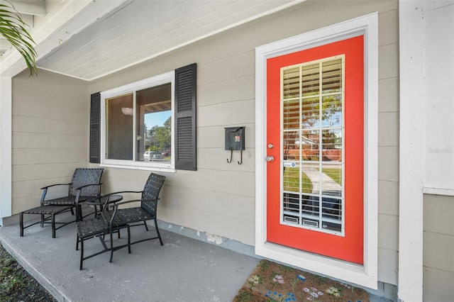 entrance to property featuring a porch