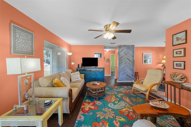 living room with ceiling fan and dark hardwood / wood-style floors