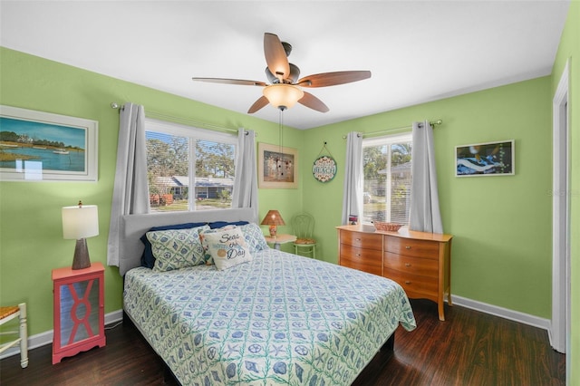 bedroom with ceiling fan and dark wood-type flooring