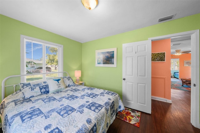 bedroom featuring dark wood-type flooring