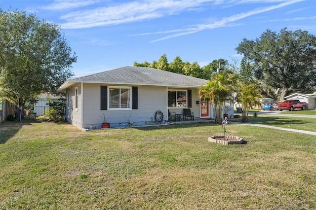 ranch-style home featuring a front yard