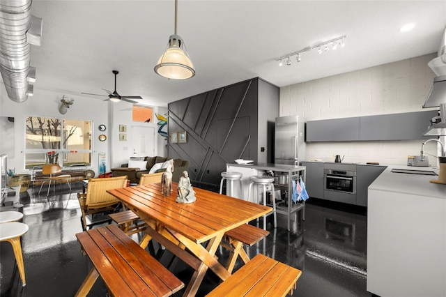 dining area with a ceiling fan