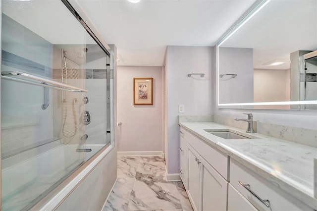 bathroom featuring vanity and combined bath / shower with glass door