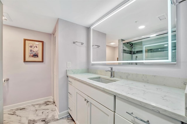 bathroom with vanity and an enclosed shower