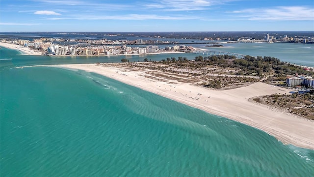 birds eye view of property featuring a view of the beach and a water view