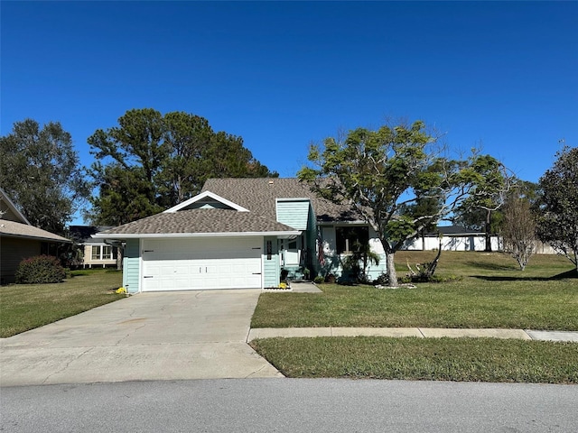 ranch-style home with a garage and a front lawn