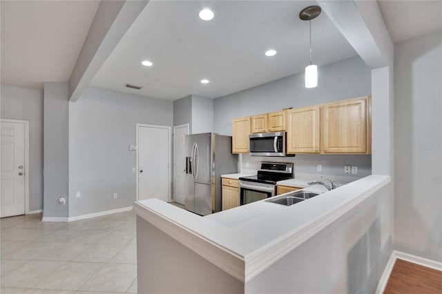 kitchen featuring decorative light fixtures, sink, kitchen peninsula, stainless steel appliances, and light brown cabinets