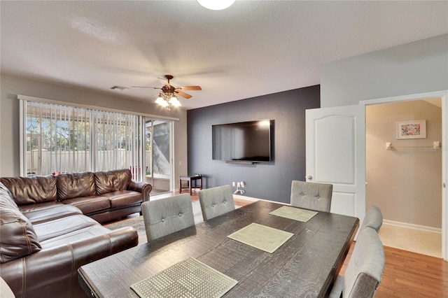 interior space with hardwood / wood-style floors and ceiling fan