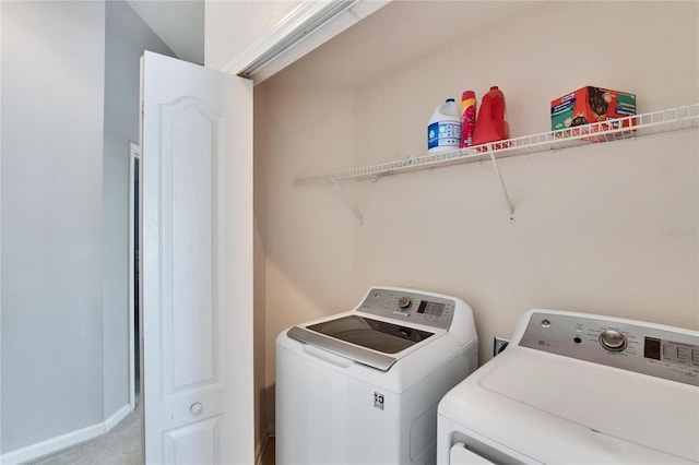 laundry area featuring separate washer and dryer and carpet floors