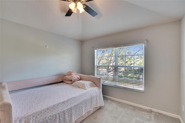 carpeted bedroom with lofted ceiling and ceiling fan