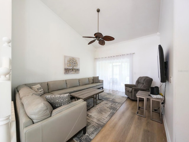 living room featuring hardwood / wood-style floors, ceiling fan, and lofted ceiling