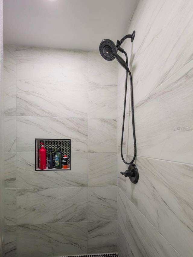 details with a tile shower