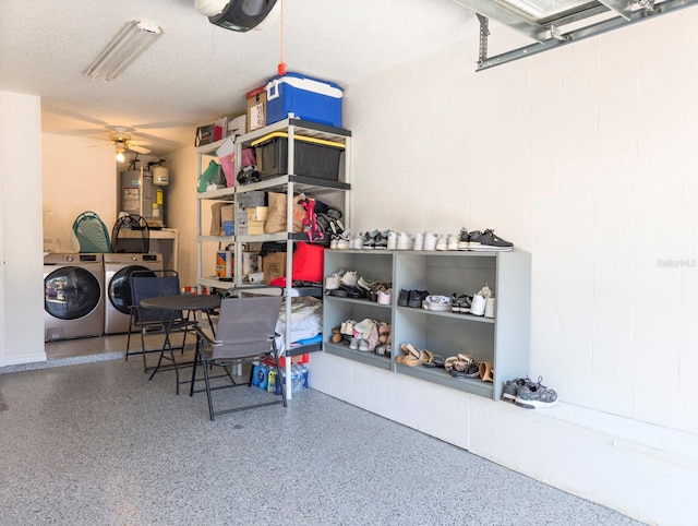 storage room featuring ceiling fan, gas water heater, and independent washer and dryer