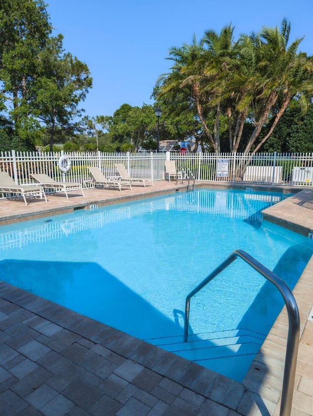 view of pool featuring a patio