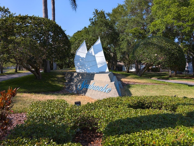 view of property's community with a yard