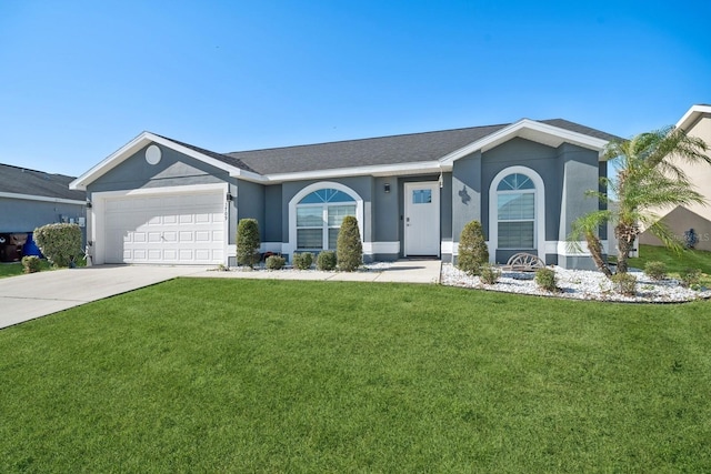 single story home with a garage and a front lawn