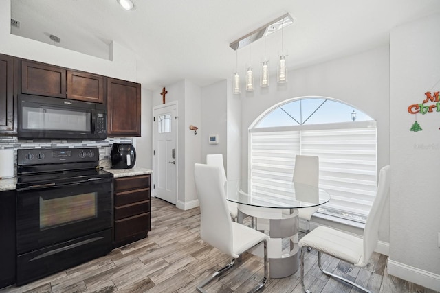 dining room featuring vaulted ceiling