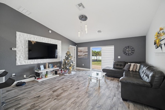 living room with lofted ceiling