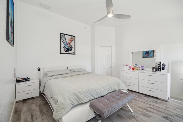 bedroom with ceiling fan and light hardwood / wood-style flooring