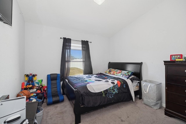 carpeted bedroom with vaulted ceiling