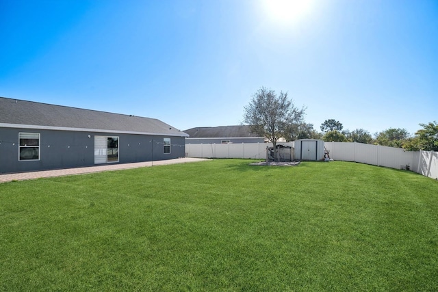 view of yard with a storage shed